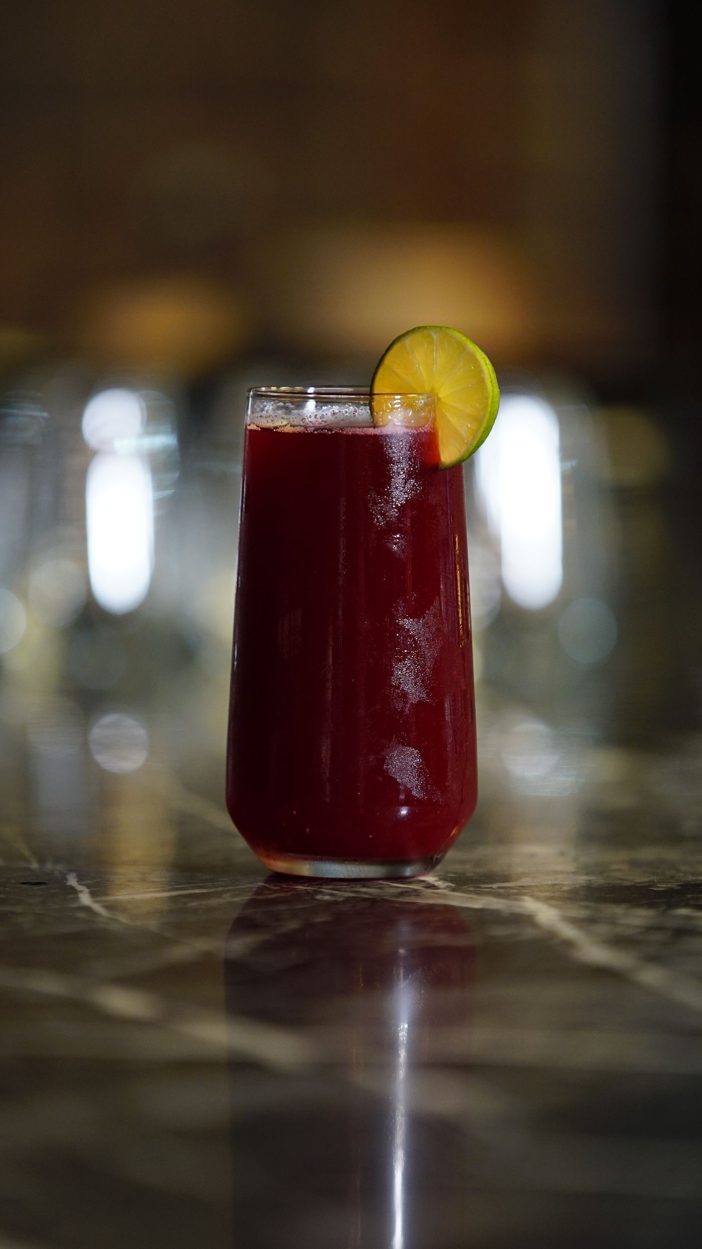 A tall glass of chilled zobo with lime